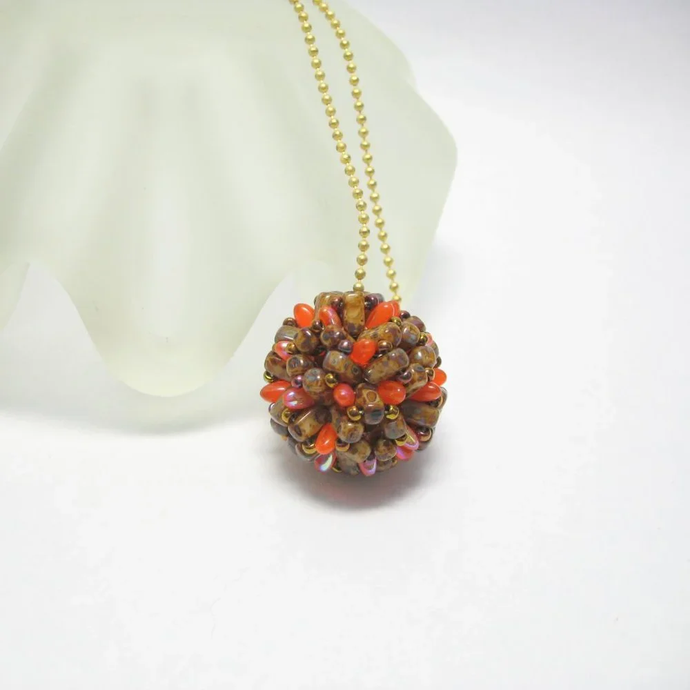 Handwoven Fall color beaded bead pendant